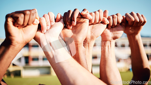 Image of Fist hands, sport community and hand closeup of exercise team together on a outdoor field. Sports support, workout and fitness friends ready for a athlete competition with solidarity and teamwork