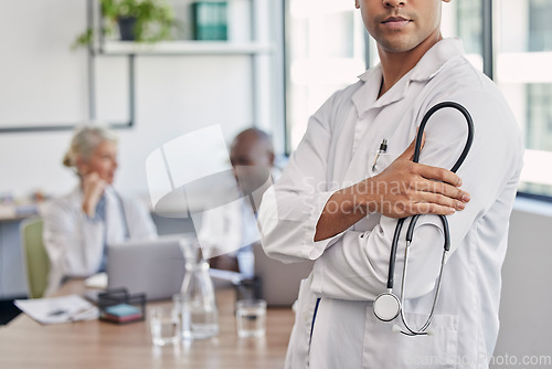 Image of Stethoscope, arms crossed and medical with hands of doctor for medicine, leadership or confidence in clinic. Wellness, healthcare and trust with man in hospital for expert, professional or consulting
