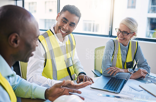 Image of Architect, laptop and meeting for industrial construction, team planning or idea strategy at office. Group of diverse engineers or contractors discussing floor plan for project layout or architecture