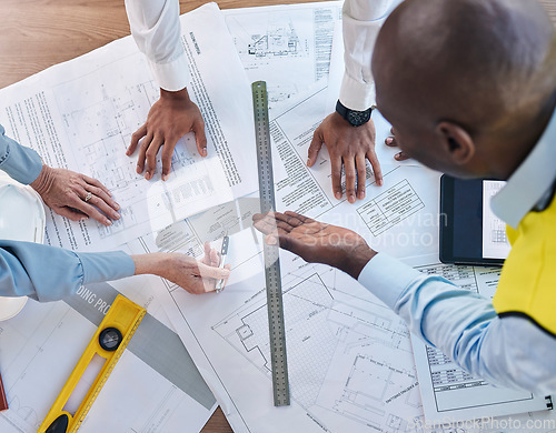 Image of Architect, hands and blueprint in meeting above for construction, team planning or strategy for project layout at office. Hand of group in engineering discussing floor plan drawing for architecture
