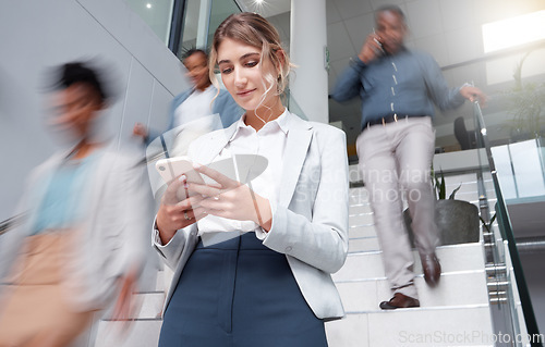 Image of Business woman, smartphone at office with motion blur and communication, fast pace and busy with technology and wifi. Chat, email and social media, female and speed with movement and mobile app