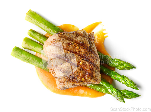 Image of grilled steak with fried asparagus