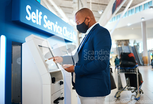 Image of Covid, travel and self service with black man and phone in airport for online booking, ticket and technology. Vacation, business trip and kiosk with passenger typing for flight, airline and check in