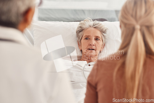 Image of Hospital visit, senior woman and consultation of a elderly person in bed listening to results. Support, medical consulting and old patient in clinic bed listen to medicine advice and counseling