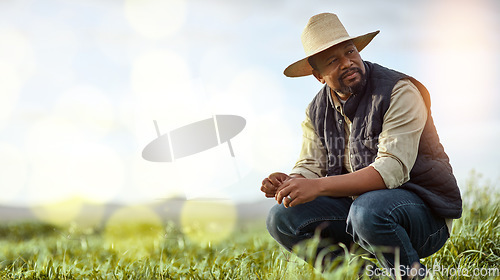 Image of Farmer, black man and mockup for agriculture and sustainability outdoor on an agro farm with bokeh. Person on grass field thinking about farming innovation, growth and ecology in the countryside