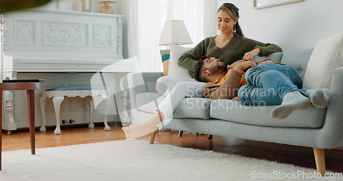 Image of Relax, love and watching tv with couple on sofa for movie, streaming or television subscription. Happy, smile and peace with man on woman legs in living room at home for video, news or film together