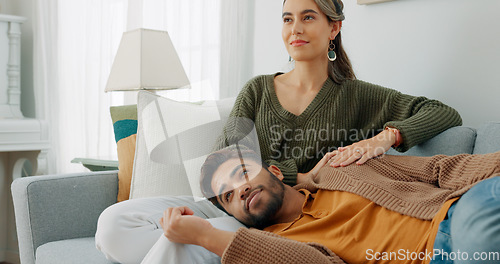 Image of Relax, love and watching tv with couple on sofa for movie, streaming or television subscription. Happy, smile and peace with man on woman legs in living room at home for video, news or film together