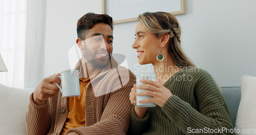 Image of Movie, coffee and couple watching tv or streaming an online series via a subscription for fun entertainment at home. Relaxing, smile and happy woman enjoying a film together on a sofa with partner