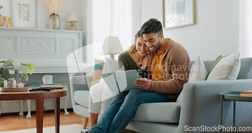 Image of Laptop, living room and couple search website information for home investment, loan or real estate property discussion on sofa. Young people on couch with pc internet, planning future together