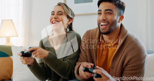 Image of Video game, fun and excited diversity couple with crazy high energy, play together and enjoy quality bonding time at home. Entertainment technology, controller and competition for happy woman and man