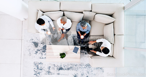 Image of Corporate, lounge and business people on couch, relax and talk during lunch break with company chill spot top view. Diversity, social and employee group together with tablet and coffee break