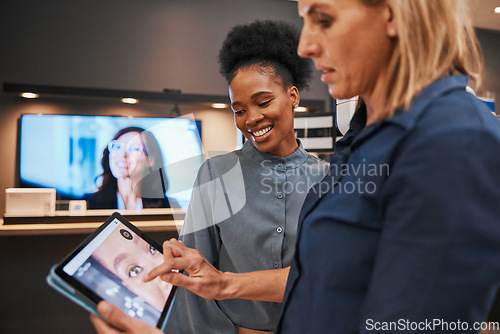 Image of Digital tablet, creative and employees in the office editing advertisement images together. Collaboration, teamwork and marketing women working or planning a creative art project in the workplace.