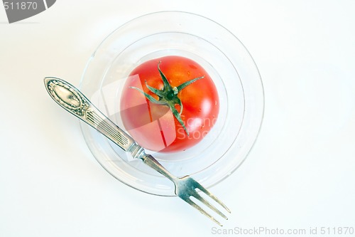 Image of Fresh tomato on the glass plate.