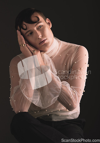 Image of Gender neutral, fashion and Victorian aesthetic with designer clothing and faux pearls in studio. Isolated, black background and lgbtq or gay model with jewelry and creativity and non binary art