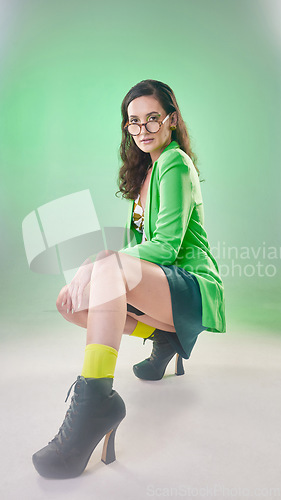 Image of Woman, 80s fashion and studio portrait with vintage glasses, beauty and vintage makeup with trippy green aesthetic. Gen z model, retro clothes and teacher cosplay character by blurred background