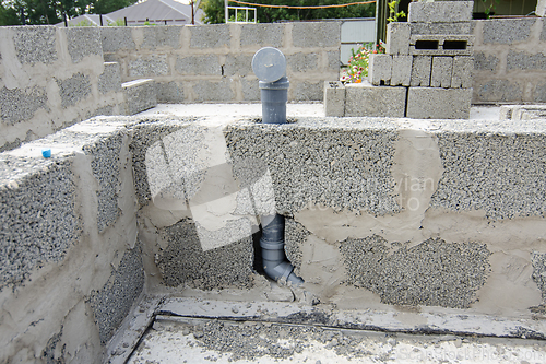 Image of Wall-mounted sewer pipe for a sink in a partition