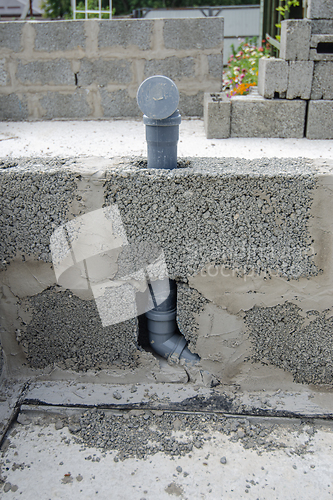 Image of Wall-mounted sewer pipe for a washbasin in a partition