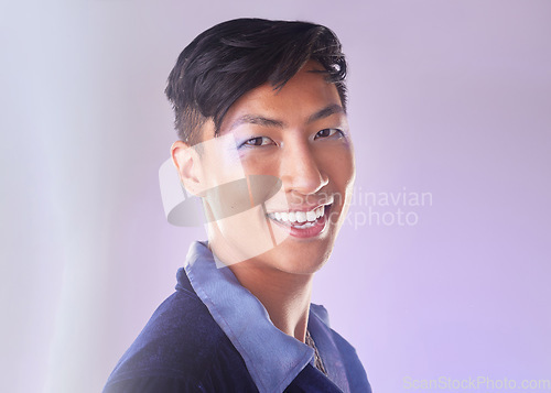 Image of Makeup, smile and portrait of gay man from Indonesia with confidence isolated on purple background. Happy, aesthetic and lgbt fashion model with beauty in studio, non binary and gender neutral design