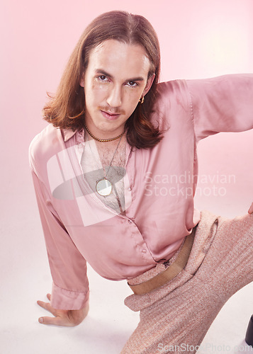 Image of Portrait, vintage fashion and lgbt man from Ukraine with confidence isolated on pink background. Happy, aesthetic and male model with beauty in studio, creative non binary and gender neutral design.