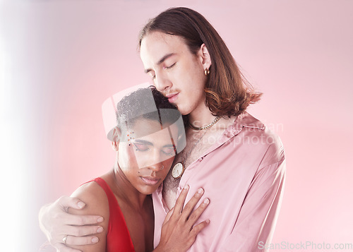 Image of Gay, beauty and lgbtq people hug isolated on studio pink background in glow, pastel and creative art aesthetic. Fashion, diversity and love, queer transgender couple of friends in makeup or cosmetics