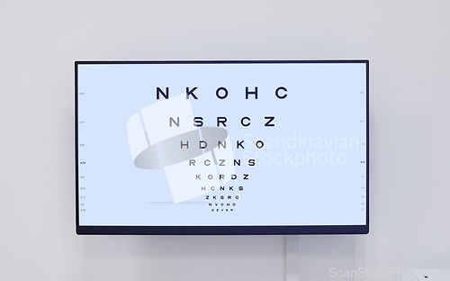 Image of Eye chart, television and screen in hospital for optometry examination, vision and wellness. Healthcare, eyecare tv and technology with snellen chart for eyesight test, ophthalmology and eyes health