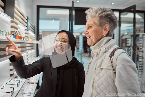 Image of Decision, glasses and senior woman with an optician for help with eyewear and shopping for a frame. Consulting, talking and Muslim employee helping an elderly patient with choice of eyeglasses