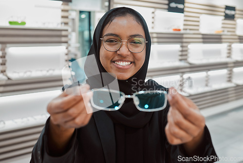 Image of Optometry, portrait and Muslim woman with glasses for vision, help and shopping at a store. Working, retail and Islamic optician helping with eyewear fitting, consultation and eye care frame