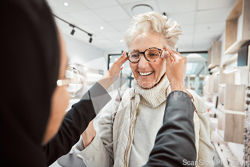 Image of Glasses, vision and optometry with a senior woman in an optician office for prescription lenses. Eyewear, eyesight and fashion with a mature customer buying new frame spectacles at the optometrist