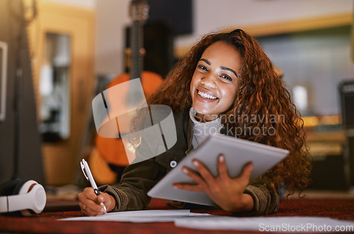 Image of Black woman, portrait smile and tablet writing music in studio for audio track, content creation or development. Happy African American female song writer smiling for lyrics holding touchscreen