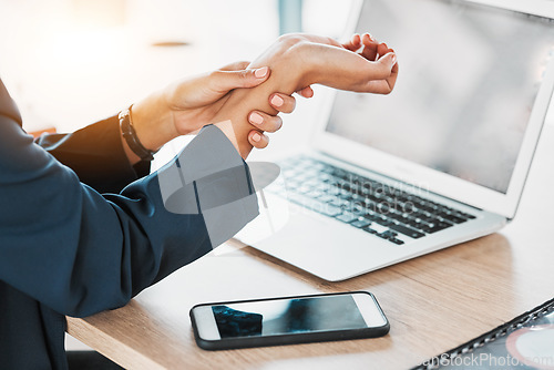 Image of Business, closeup and woman with wrist pain, burnout and laptop in office, stress and deadline. Zoom, female employee and professional with smartphone, injury and muscle strain in workplace and hand