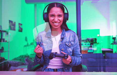 Image of Gamer success, headphones winner and woman in home at night in neon light for web esports. Gaming face portrait, technology or gen z female with controller celebrating winning, victory or achievement