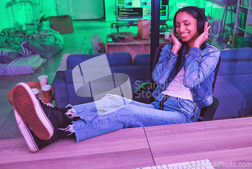 Image of Programmer, headphones or relax in neon house after technology coding, software development or cybersecurity safety. Happy, smile or woman listening to music, radio or podcast in night programming