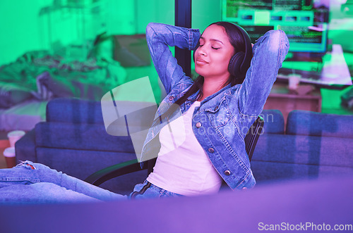 Image of Woman, headphones or relax in neon house after technology coding, software development or cybersecurity safety. Happy, programmer or hands behind head in night programming success with music podcast