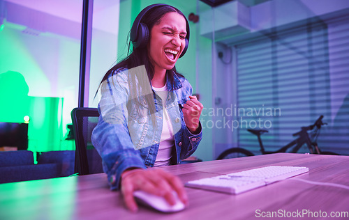 Image of Woman, headphones or success fist in neon gaming, wow esports or challenge winner in night basement. Smile, happy or excited gamer cheering for game victory, cyberpunk achievement or yes expression