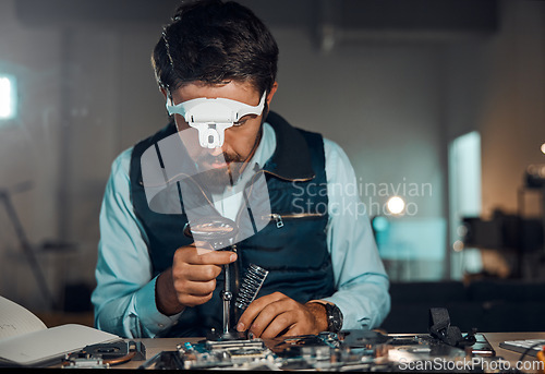 Image of Technician, engineer and IT professional repair motherboard, microcircuit or electronic device in a workshop or shop. Person, man and guy fixing hardware of a computer for technology in a lab