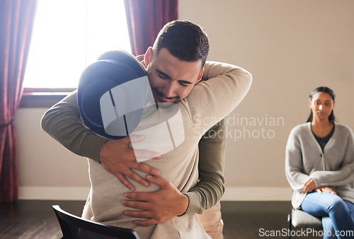 Image of Support by woman hug a crying man for comfort, grief and care after bad news or problems in a home or house. Cancer, sad and depression by people hugging for empathy, love and hope together