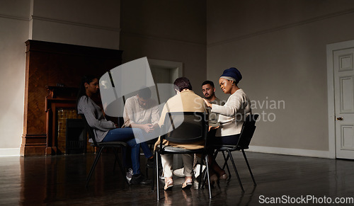 Image of Support, group of people in therapy a community center and understanding, sharing feeling and talking in session. Mental health, addiction or depression, men and women with therapist sitting together