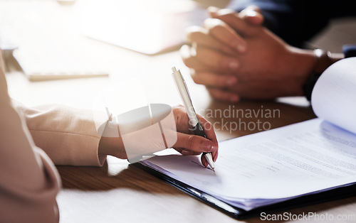 Image of Business people, hands and signing contract, form or application for hire, recruitment or policy on table. Hand of person writing or filling in paperwork with pen for deal, agreement or information