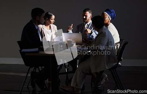 Image of Business people, leader and meeting with laptop for idea, goal or vision for startup company in office. Night, planning and collaboration by team in innovation, strategy or proposal negotiation