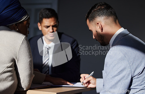 Image of Business people, law firm and signing contract agreement, policy or form in development process on table. Male attorney or corporate lawyer filling application for b2b, collaboration or partnership