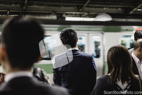 Image of Passengers traveling by Tokyo metro.