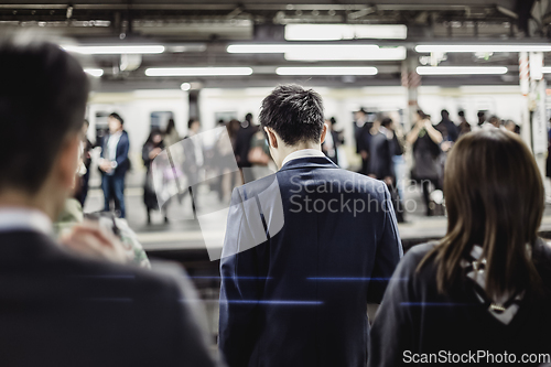 Image of Passengers traveling by Tokyo metro.