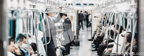 Image of Passengers traveling by Tokyo metro.