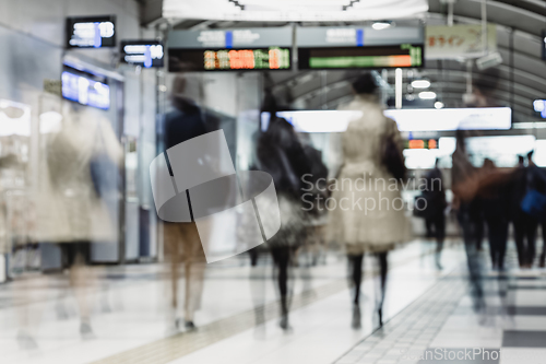 Image of Business people traveling by Tokyo metro.