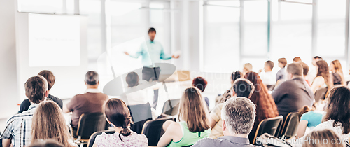 Image of Speaker at Business convention and Presentation.