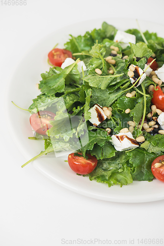 Image of Green salad with vegetables and cheese