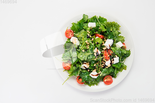 Image of Green salad with vegetables and cheese