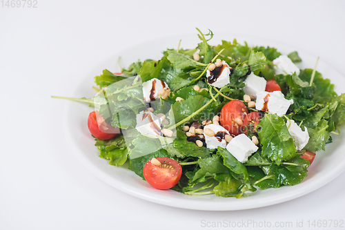 Image of Green salad with vegetables and cheese