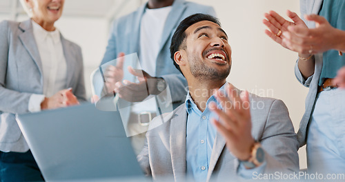 Image of Business people, celebration and applause for man on laptop in office. Success, congratulations and group of staff clapping to celebrate goals, targets or achievements with happy employee on computer