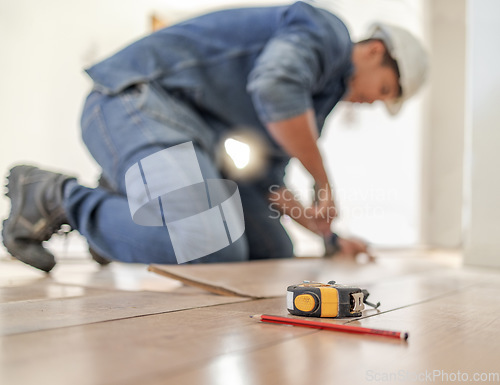 Image of Construction worker tape measure, wood carpenter and home floor renovation of a builder. Working, woodwork and handcraft of a manufacturing, building and house maintenance development of an artisan